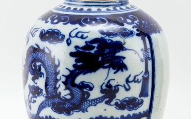 UNDERGLAZE BLUE AND WHITE PORCELAIN JAR Decorated with dragons guarding a temple door. No cover. Height 10.5".