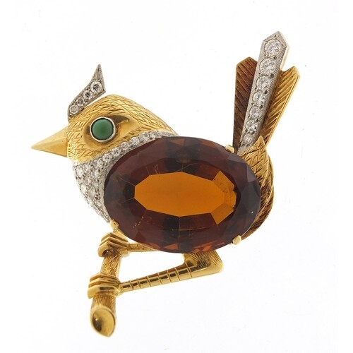 Unmarked gold and citrine bird on a branch brooch set with d...