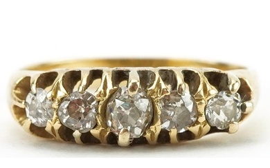 Unmarked gold graduated diamond five stone ring, total diamo...