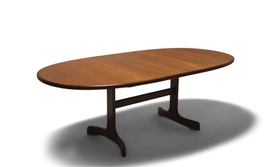 VICTOR WILKINS An oval teak extending dining table...