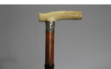 Walking stick with silver and carved bone handle, approx 89c...
