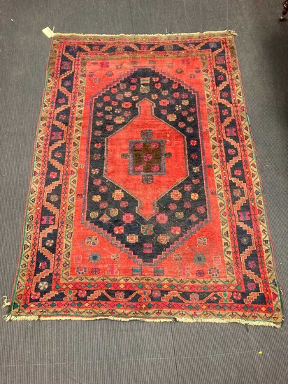 a hamadan red ground rug, 227 x 154cmMinor fraying to the end and edgesGeneral wear and reducution