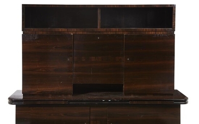An Art Deco macassar ebony cabinet en suite with...