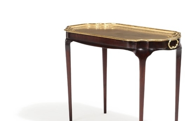 A 20th century Rococo style mahogany side table with loose brass tray. H. 56. L. 76. W. 42 cm.