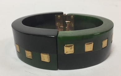A Bakelite hinged black and green bangle with square