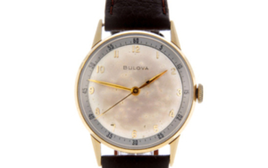 BULOVA - a gentleman's yellow metal wrist watch.