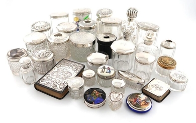 A collection of silver-mounted dressing table jars and...