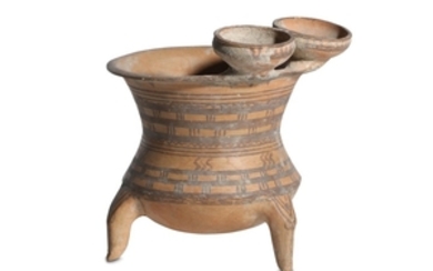 A NEAR EASTERN POTTERY THREE-FOOTED VESSEL Circa 1st...