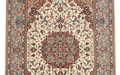 Signed Isfahan rug on silk warps, classic medallion design on light base. Persia. 20th century. 203×129 cm.