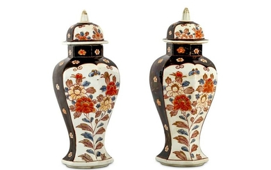 AN UNUSUAL PAIR OF JAPANESE IMARI VASES AND COVERS