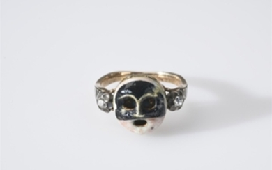 A historic 14k gold mask ring