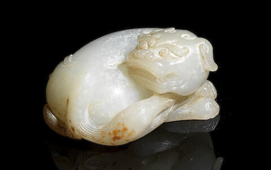 A pale green jade carving of a mythical beast