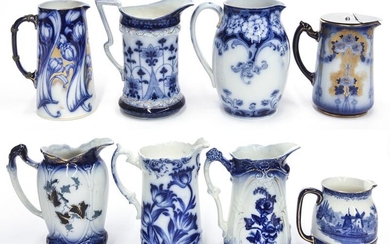 (8) Antique flow blue pitchers.