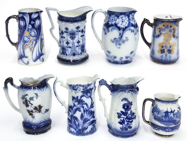 (8) Antique flow blue pitchers.