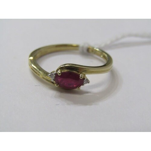 9ct YELLOW GOLD RUBY & DIAMOND RING, principal oval cut ruby...
