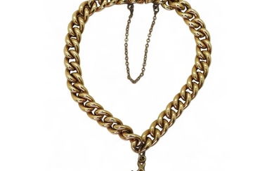 A 14k gold gold curb chain bracelet, with an attached smoky ...