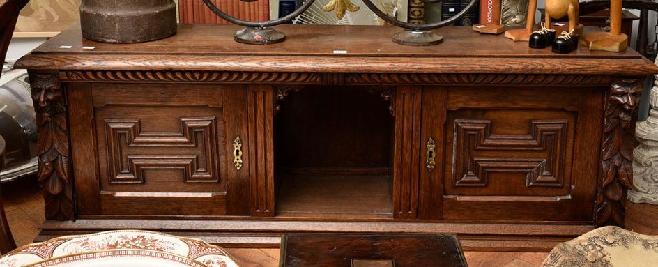A 19TH CENTURY FRENCH CARVED OAK DESK CABINET, 157 CM LONG