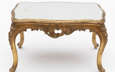 A 19TH CENTURY LOUIS XV STYLE GILTWOOD OCCASIONAL TABLE OF SERPENTINE FORM WITH A MIRROR TOP. 46CM H X 74CM W X 47CM D.