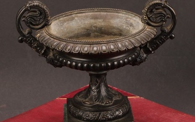 A 19th century dark patinated bronze shallow campana mantel ...