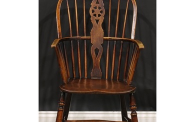 A 19th century elm and ash Windsor elbow chair, shaped and p...