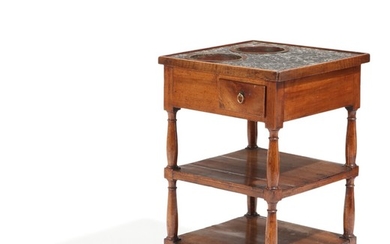 A 19th century mahogany bed table, greyish marble top with two copper buckets, apron with drawer. H. 70. W. 43. D. 43 cm.