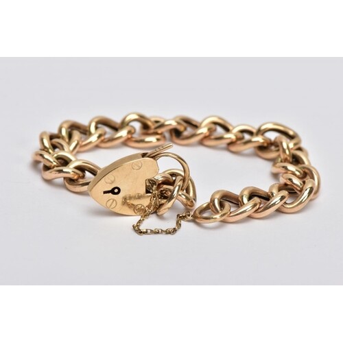 A 9CT GOLD CURB LINK BRACLET, with a heart padlock clasp and...