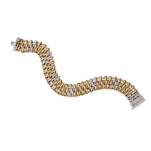 A 9CT TWO COLOUR GOLD TRIPLE ROW BRACELET, knitted links and...