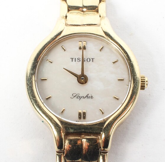 A 9ct gold ladies Tissot cocktail wrist watch, the mother of pearl dial with batons denoting hours