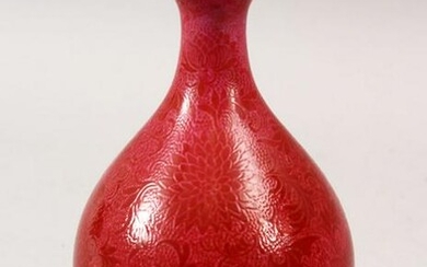 A CHINESE CORAL RED GROUND INCISED PORCELAIN VASE, the
