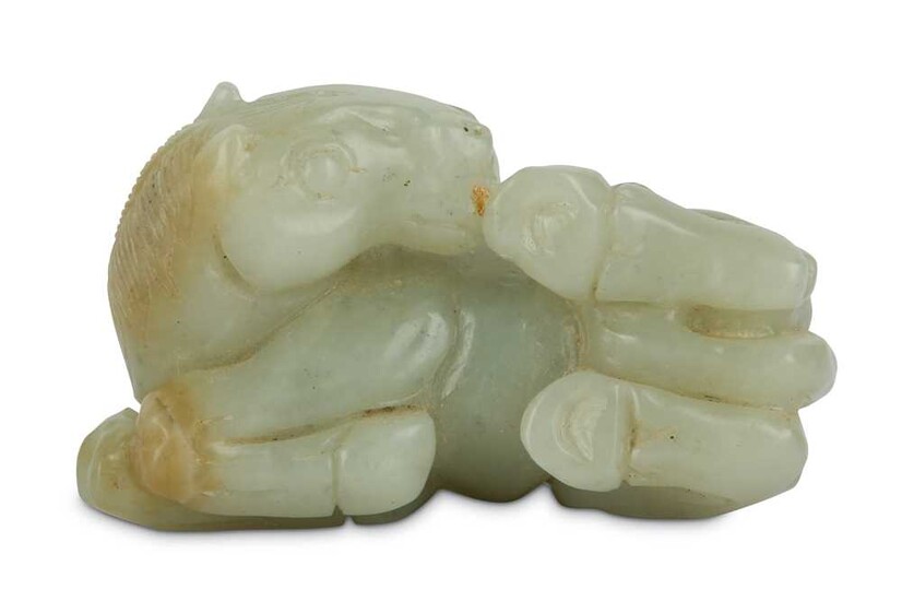 A CHINESE WHITE JADE CARVING OF A RECUMBENT HORSE.