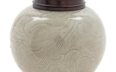 A Celadon Glazed Carved 'Floral' Porcelain Jar Height 4