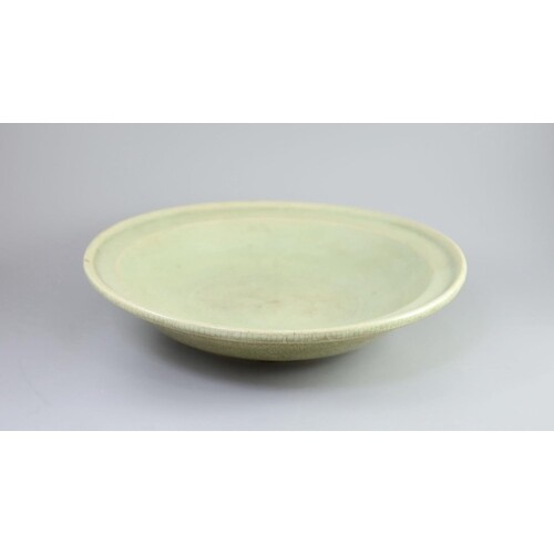 A Chinese Ming Longquan celadon dish, 15th/16th century, cra...