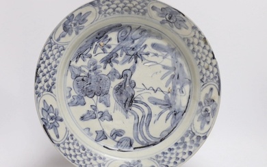 A Chinese Swatow blue and white 'phoenix' plate, late Ming, ...