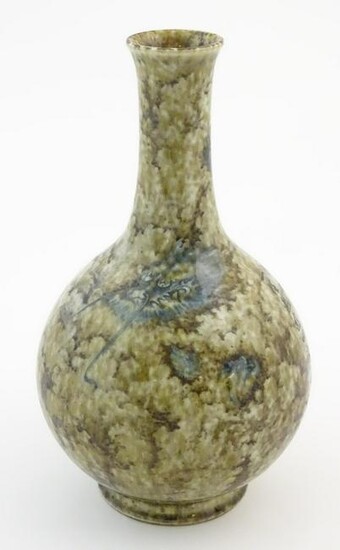 A Chinese bottle vase with a mottled glaze decorated