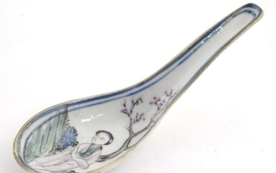 A Chinese famille rose soup spoon decorated with a