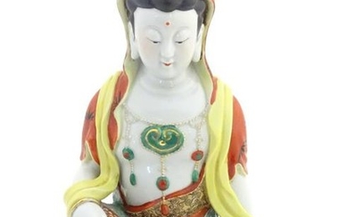 A Chinese famille rouge ceramic figure of a seated lady