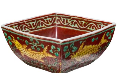 A Chinese iron-red, green and yellow glazed bowl with fish and Jiajing six-character mark, probably