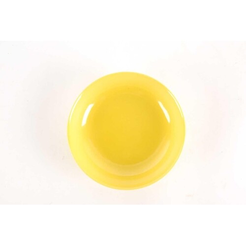 § A Chinese monochrome yellow dish, with shallow sides, on a...