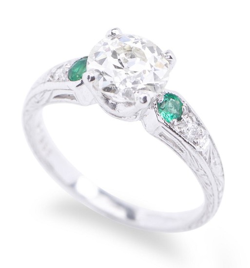 A DIAMOND AND EMERALD RING