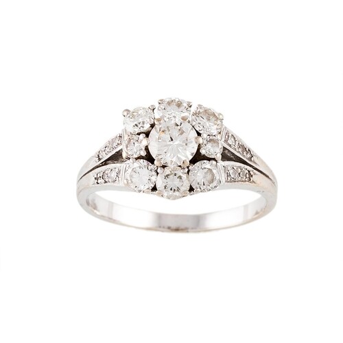 A DIAMOND CLUSTER RING, the brilliant cut diamonds to diamon...