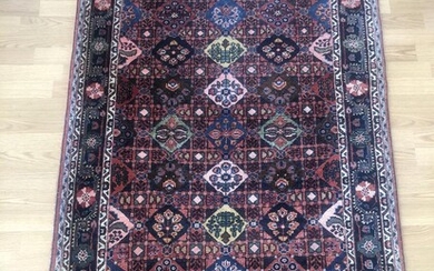 A Djozan rug, Persia. All over design of multi colored medallions. Fine colors. Ca. 1960–1970. 170×108 cm.