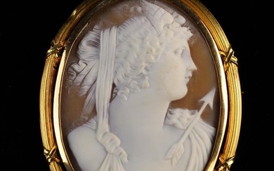 A Fine 19th Century Carved Shell Cameo Brooch in 18 carat gold mount. The oval cameo depicting the b