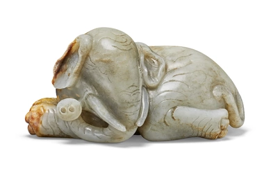 A GREY AND RUSSET JADE FIGURE OF A RECUMBENT ELEPHANT CHINA, 17TH CENTURY