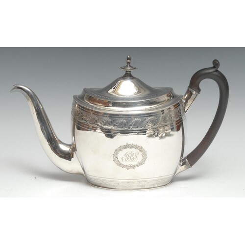 A George III silver oval teapot, bright-cut engraved with ba...
