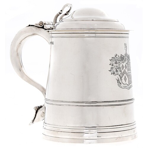 A George III silver tankard, of tapered form with ogee domed...
