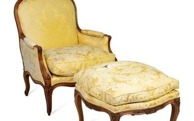 A Louis XV Style Carved Beechwood Bergere and Ottoman