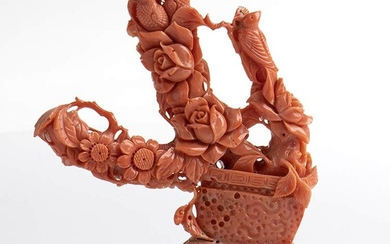A Momo or Cerasuolo coral (Corallium Elatius) sculpture depicting a...