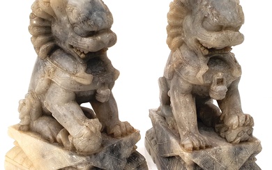 A PAIR OF CHINESE FINELY CARVED HARDSTONE FOO DOGS