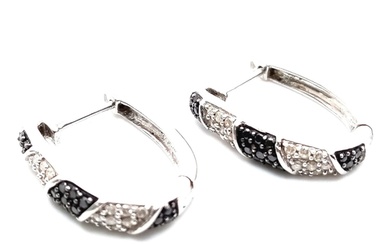 A Pair of 9K White Gold, Black & White Diamond Set Earrings....