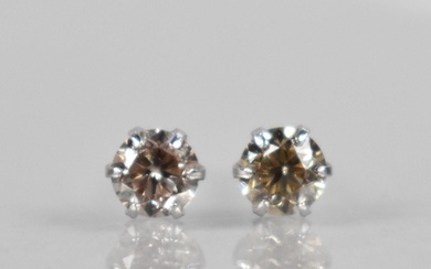 A Pair of Diamond and Platinum Stud Earrings, Round Brillian...